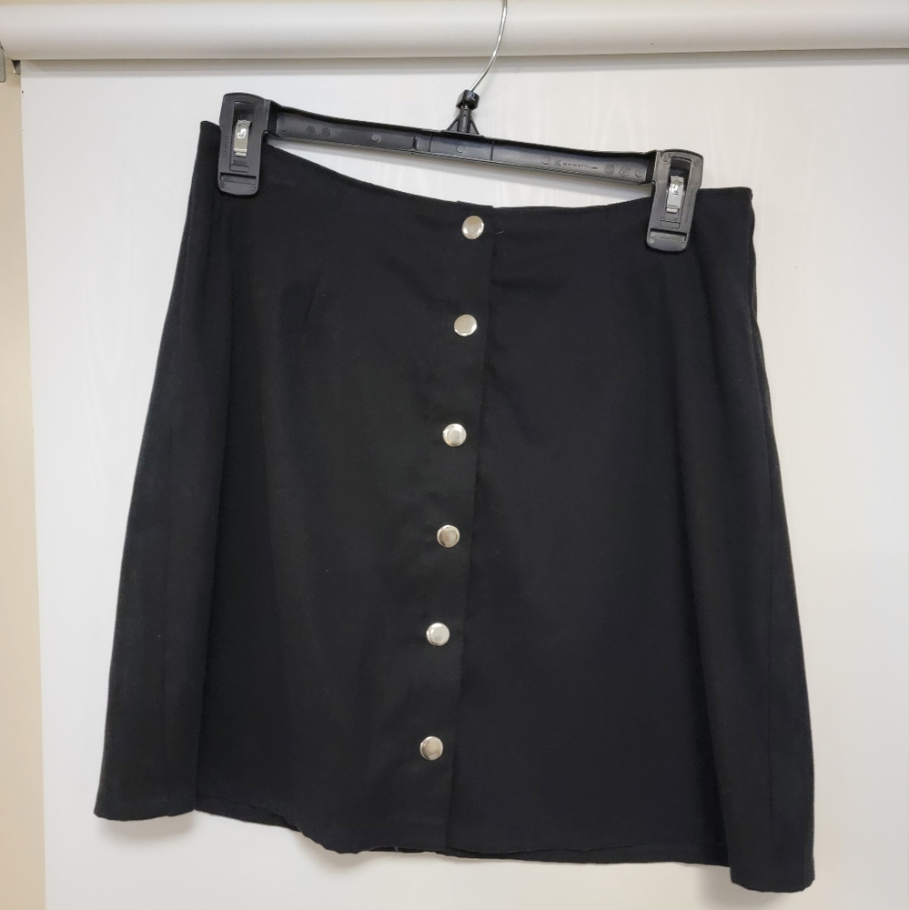 Black mini skirt with buttons. Size M